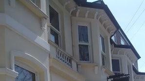 A Victorian-style building with multiple windows and a sign that reads "Seafood House." - Seafield House (Hove)