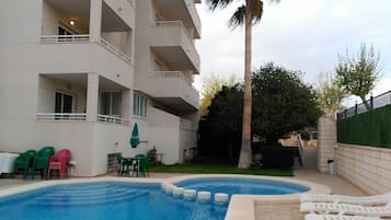 Outdoor pool, pool umbrellas, pool loungers
