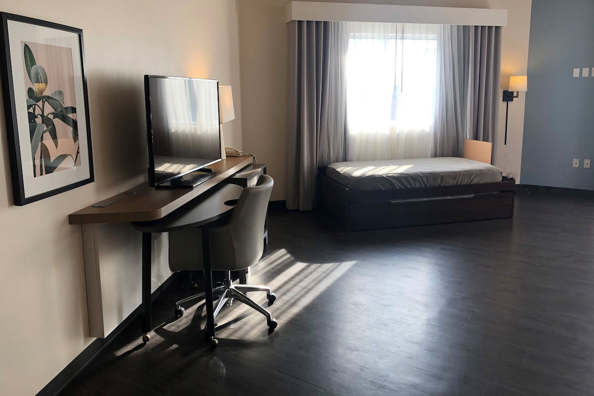 Suite, Multiple Beds (TDM Stadium View) | In-room safe, desk, iron/ironing board, WiFi (free)