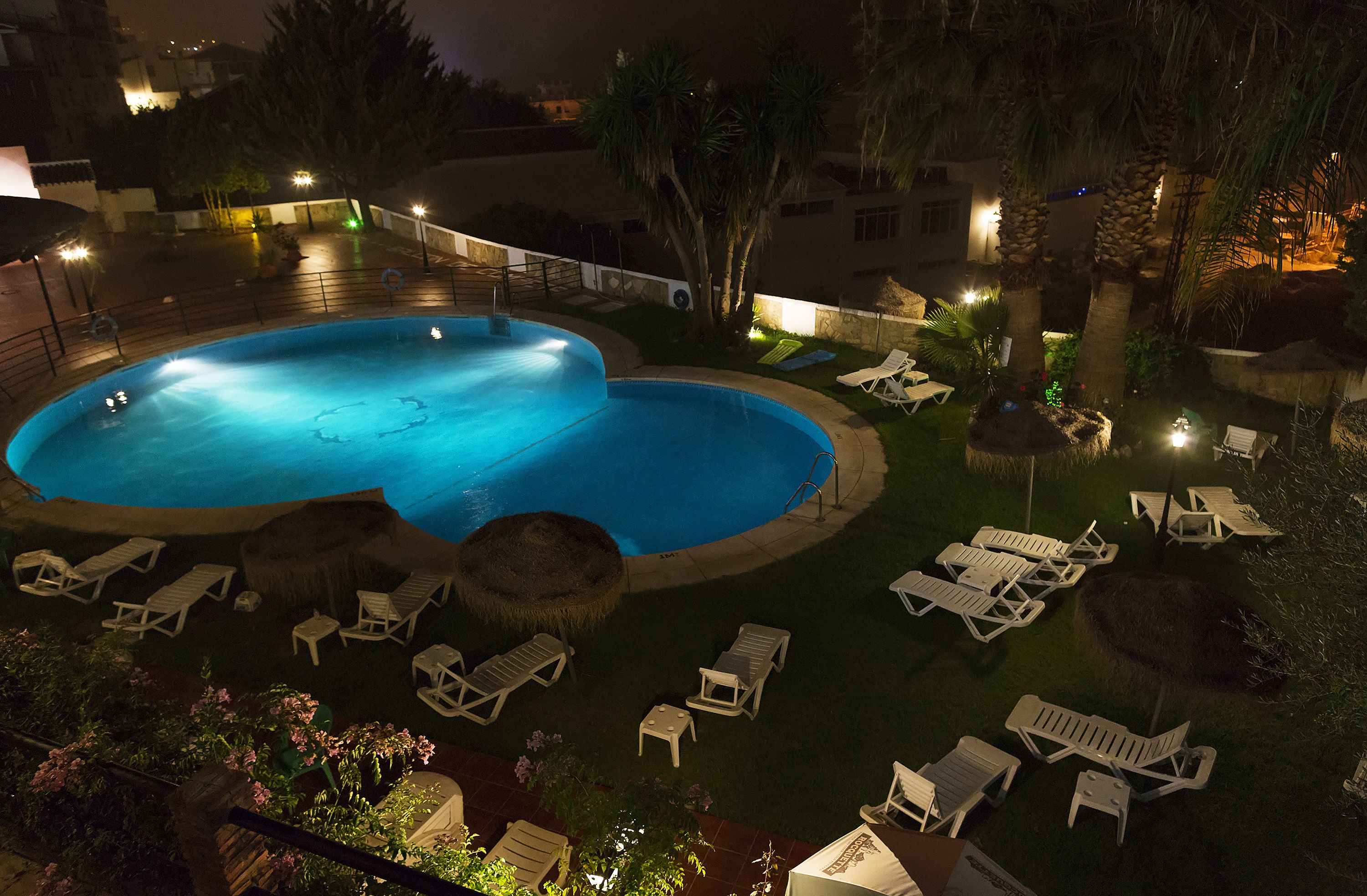 seasonal outdoor pool, pool umbrellas, pool loungers