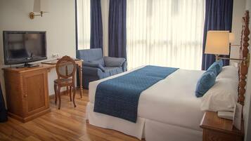 Luxe beddengoed, een minibar met enkele gratis items