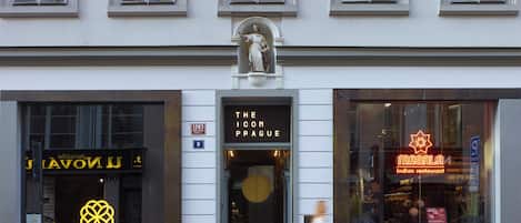 A building with storefronts including 'The Icon Prague' and 'Masala Indian Restaurant'.