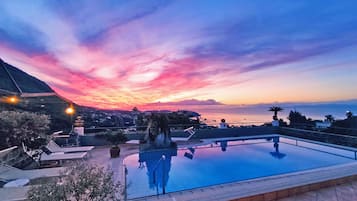 Seasonal outdoor pool, pool loungers