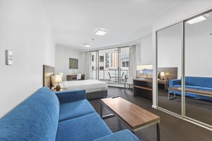 Standard Studio with Balcony (Daily Housekeeping) | Living area | 40-inch flat-screen TV with digital channels, TV