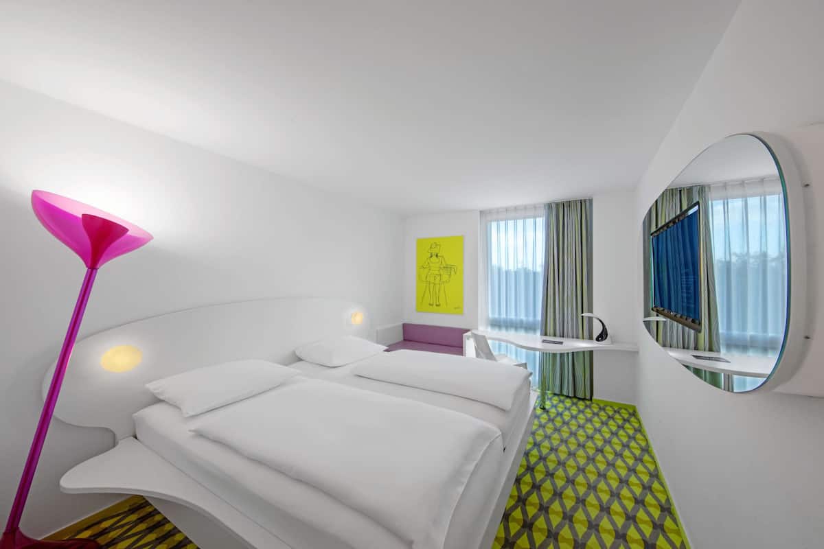 Premium bedding, desk, laptop workspace, soundproofing