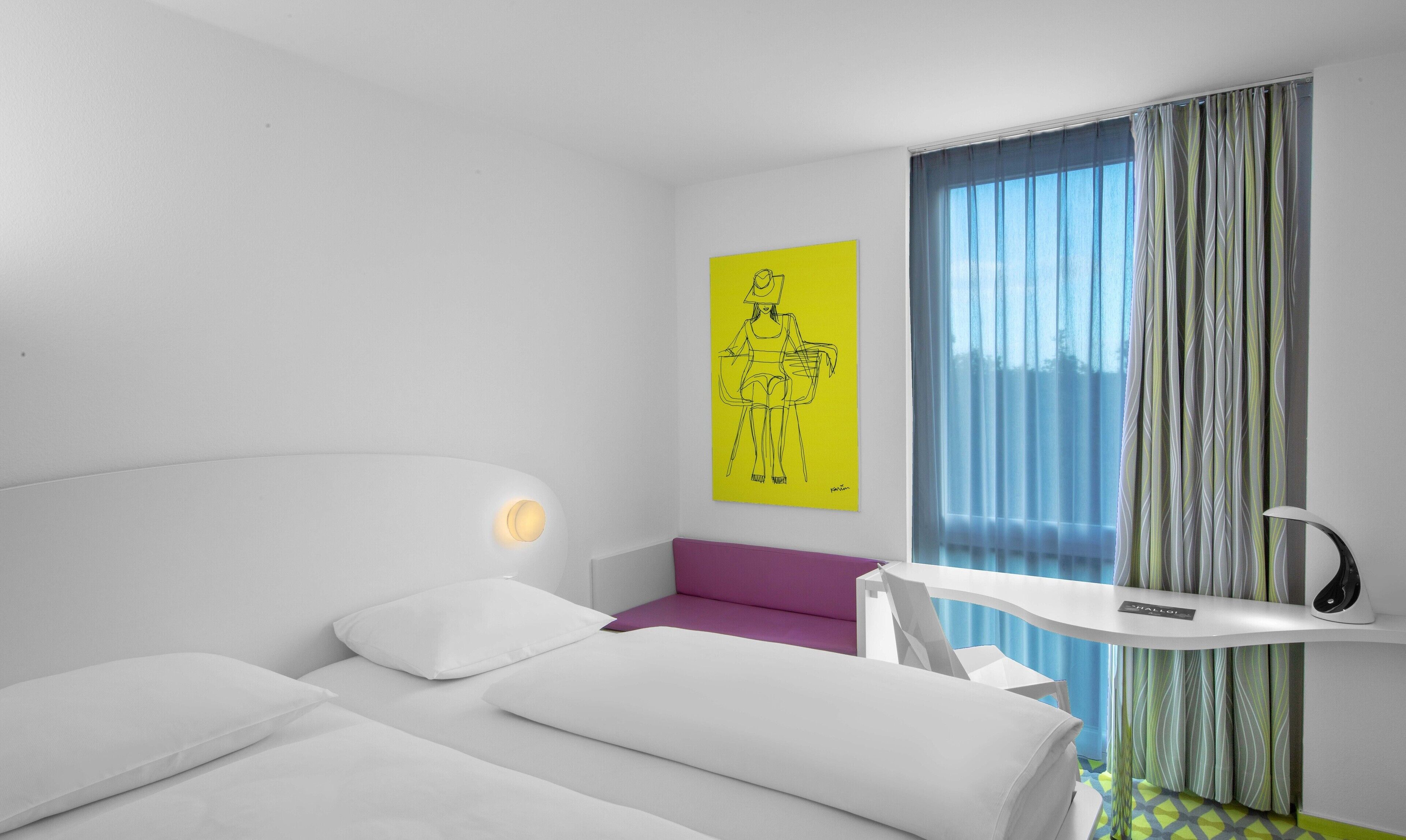 Premium bedding, desk, laptop workspace, soundproofing