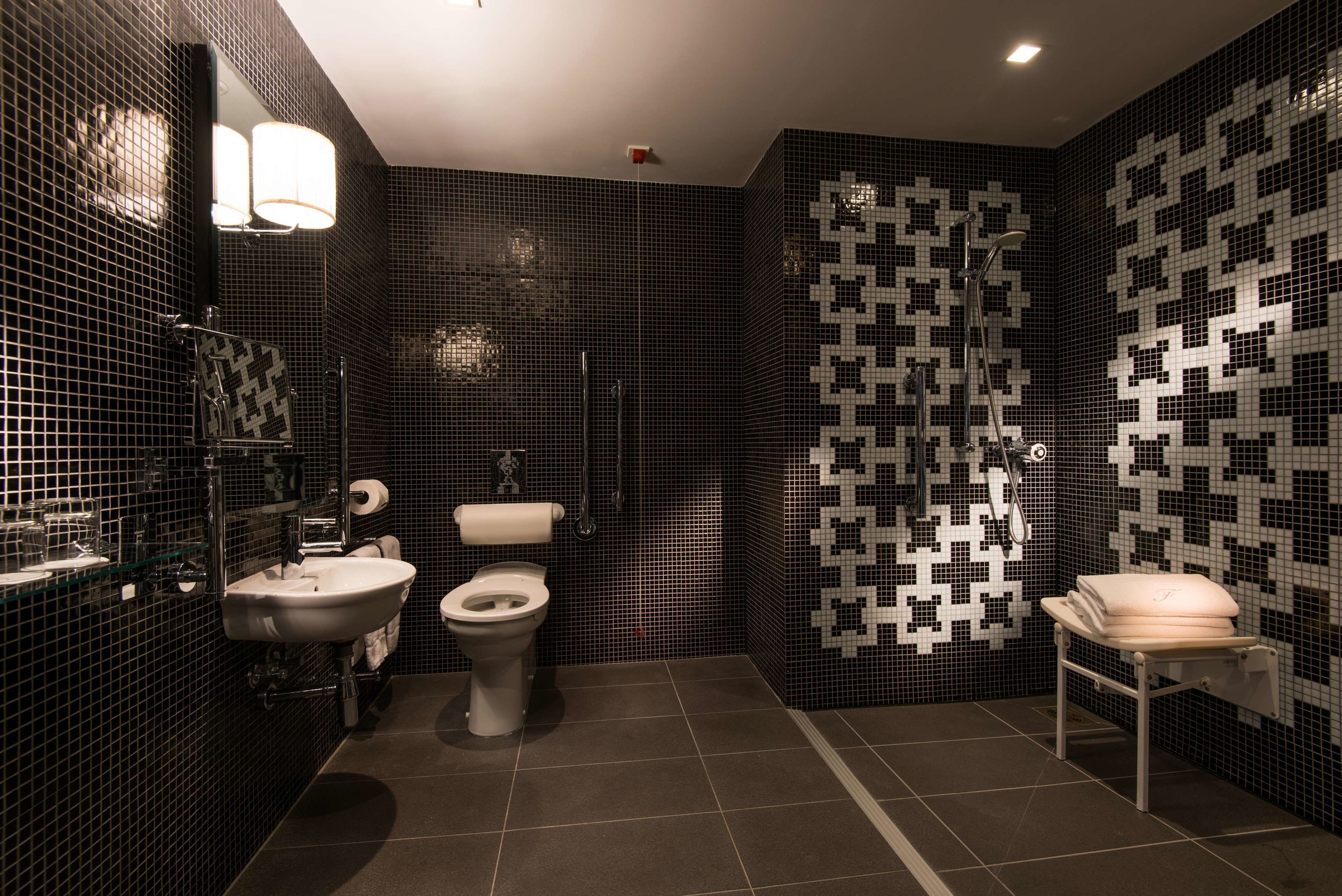 designer toiletries, hair dryer, bathrobes, slippers