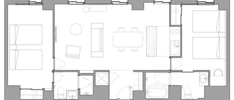 A floor plan of a hotel with multiple rooms, including a kitchen, dining area, and bathrooms.