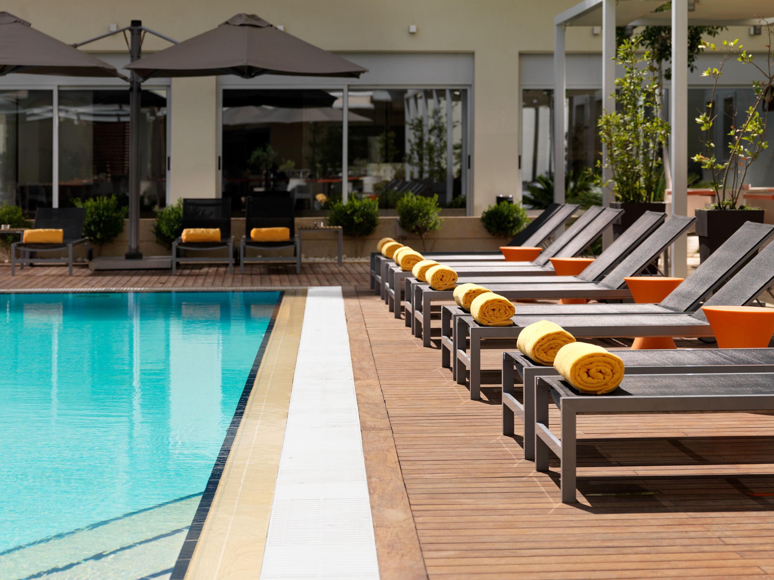 outdoor pool, pool umbrellas, pool loungers