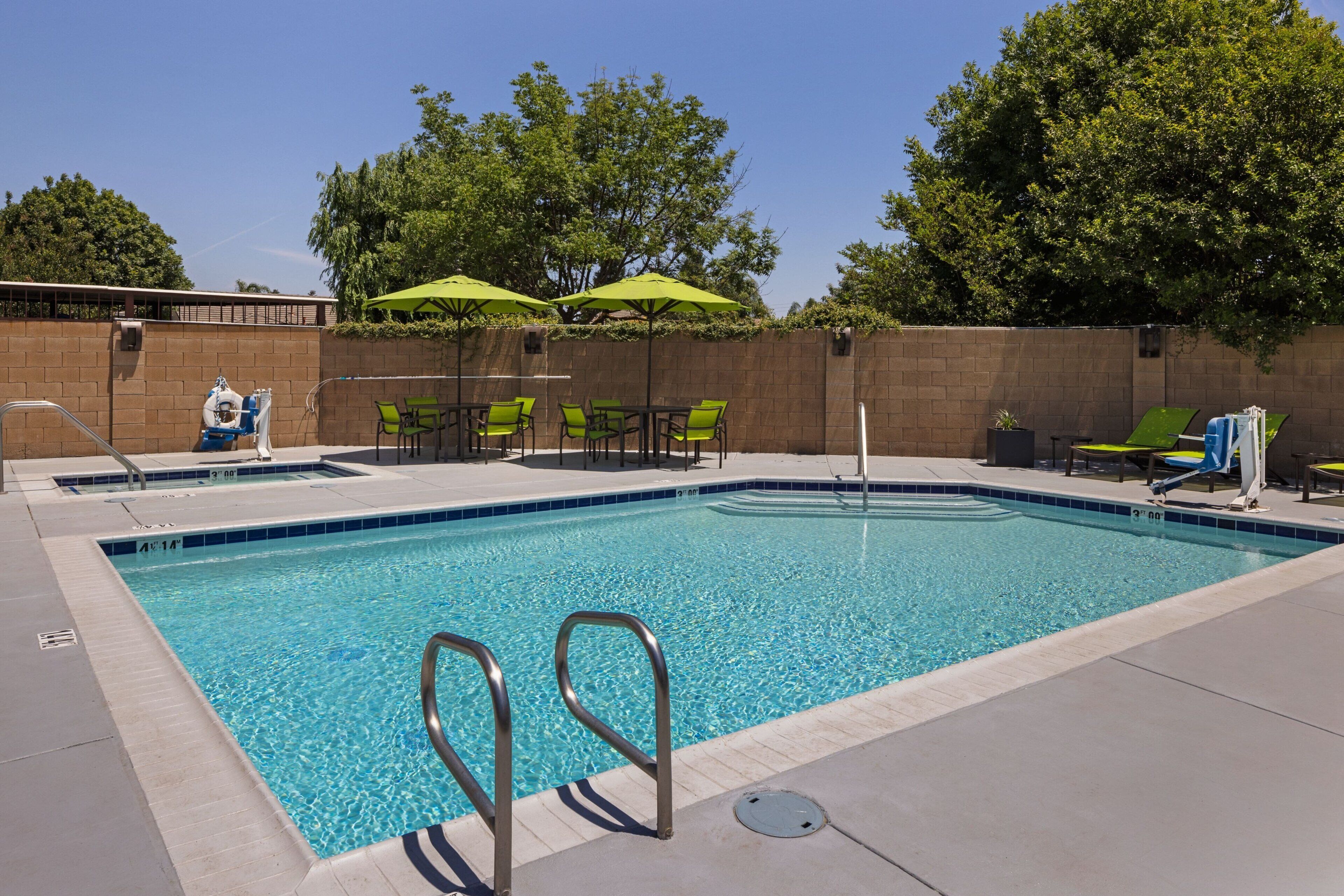 outdoor pool, pool umbrellas, pool loungers