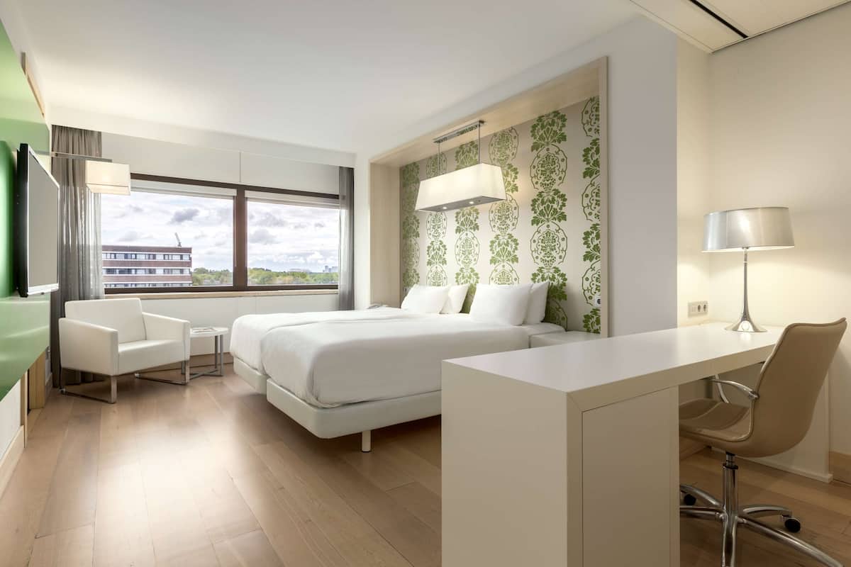 Premium bedding, memory-foam beds, minibar, in-room safe