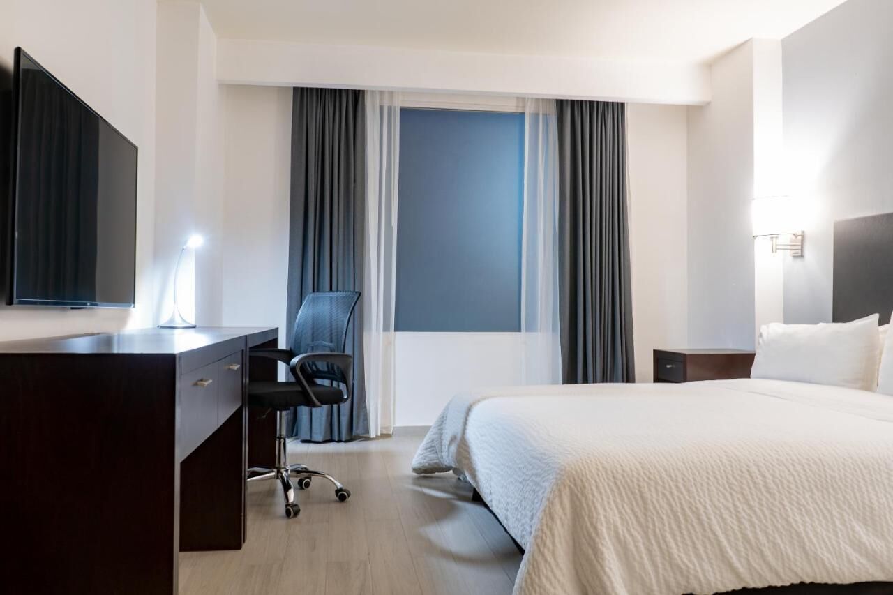 Donzen dekbedden, pillowtop-bedden, een kluis op de kamer, een bureau