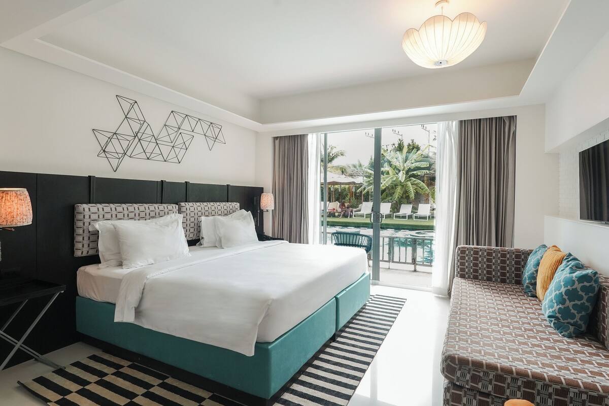 Deluxe Room, Pool Access | 1 bedroom, in-room safe, individually decorated, desk