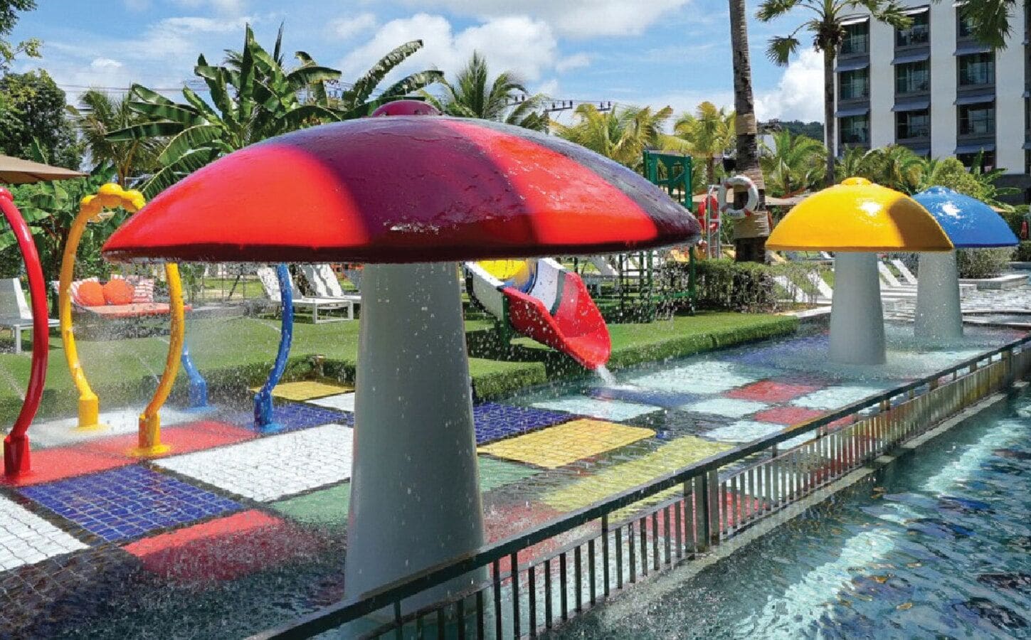 A water play area with colorful slides and a pool.