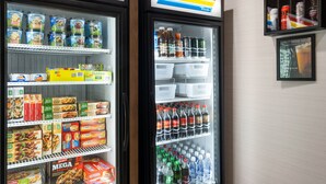 Two refrigerated display cases with various food items and beverages.