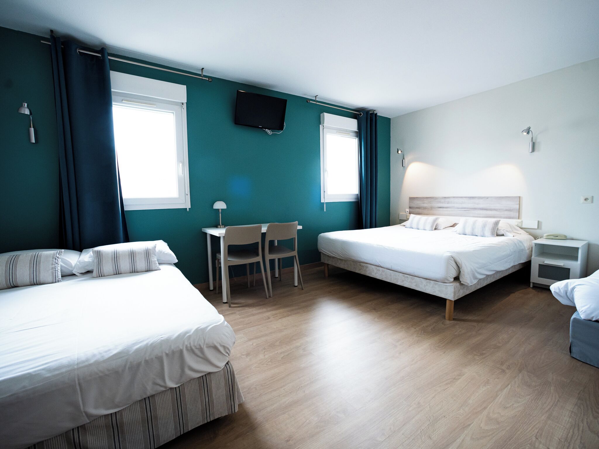 family room | premium bedding, individually decorated, desk, blackout curtains