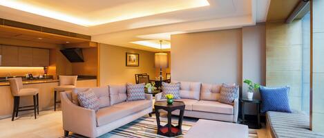 A modern living room with a sofa set, a coffee table, and a small side table.