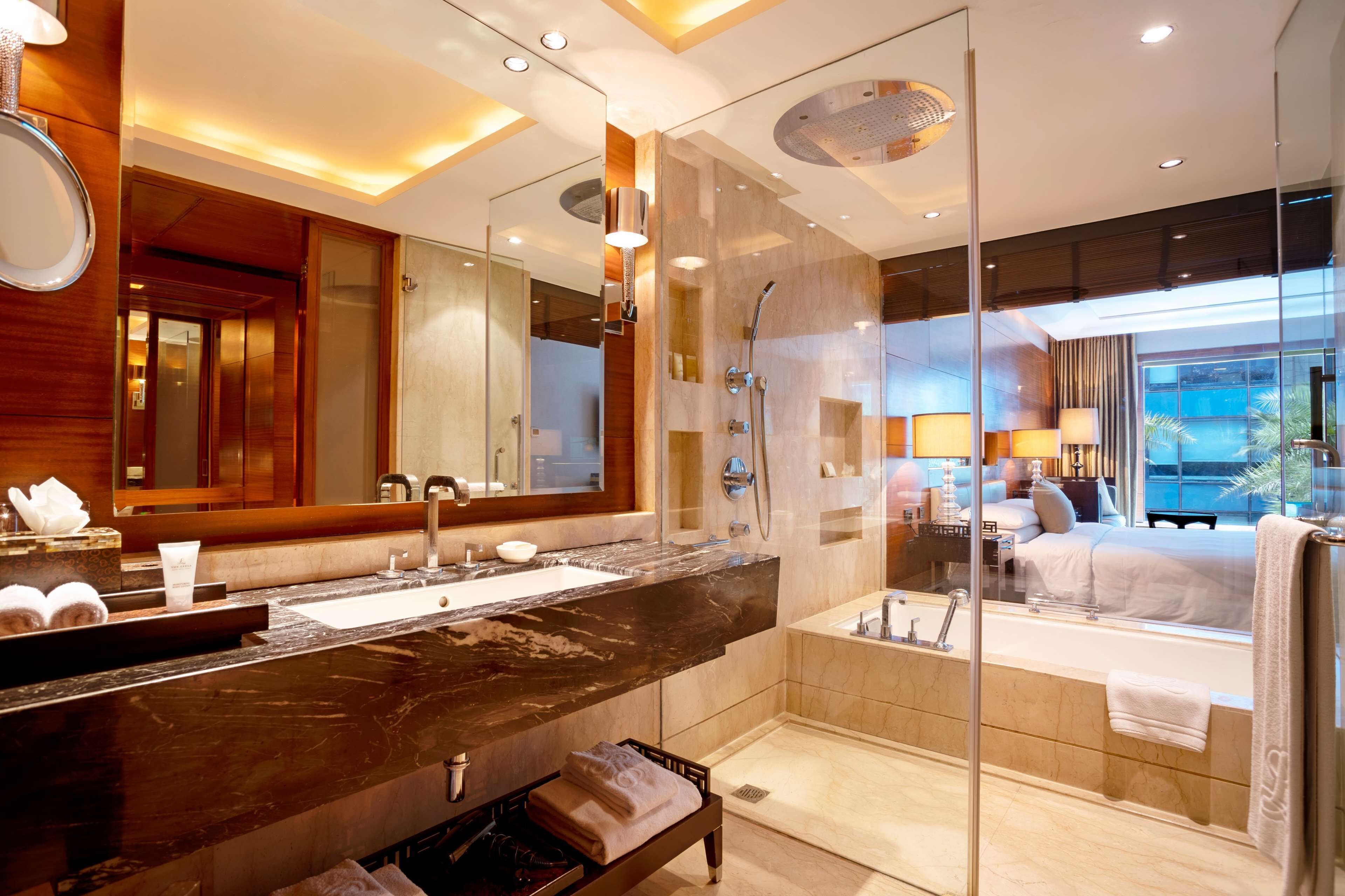 deluxe room, 1 king bed | bathroom | separate bathtub and shower, deep-soaking bathtub, rainfall showerhead