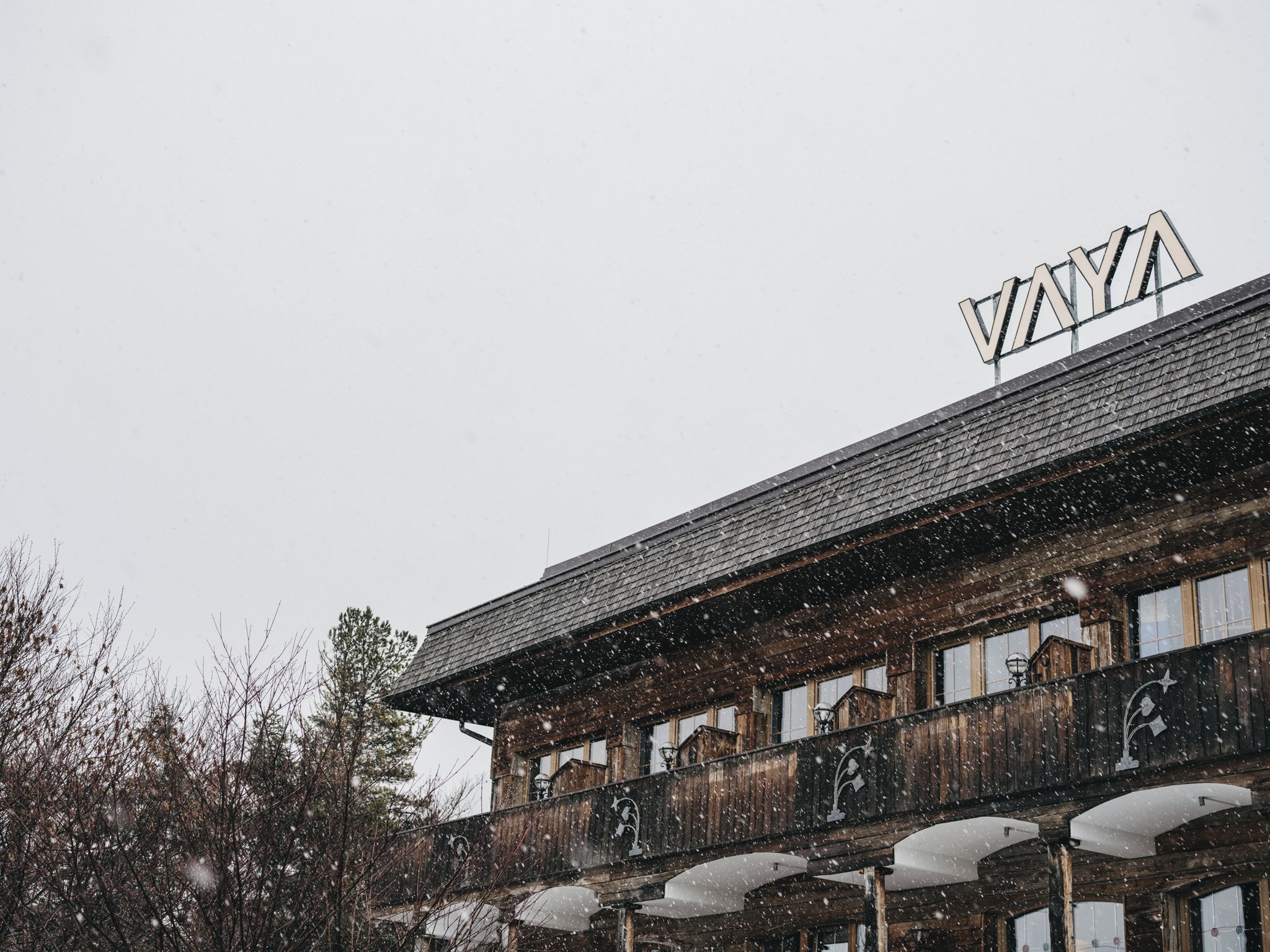 A wooden building with a sign reading 'VAYYA' on the roof.