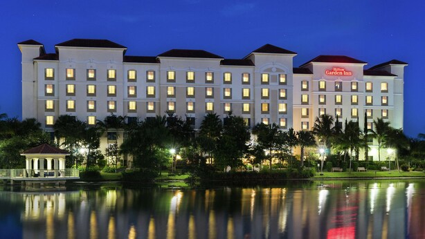 A large hotel with multiple floors and a well-lit facade.