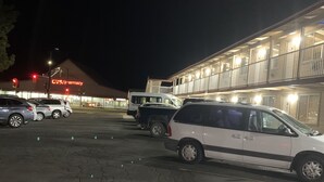A CVS pharmacy with a parking lot at night. - Beverly Lodge (South Lake Tahoe)