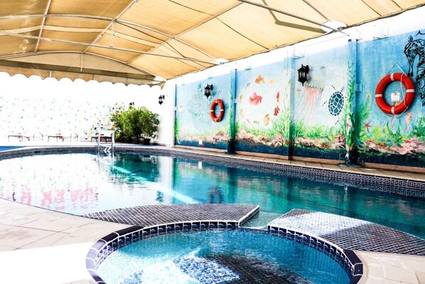 Indoor pool, free pool cabanas, pool umbrellas