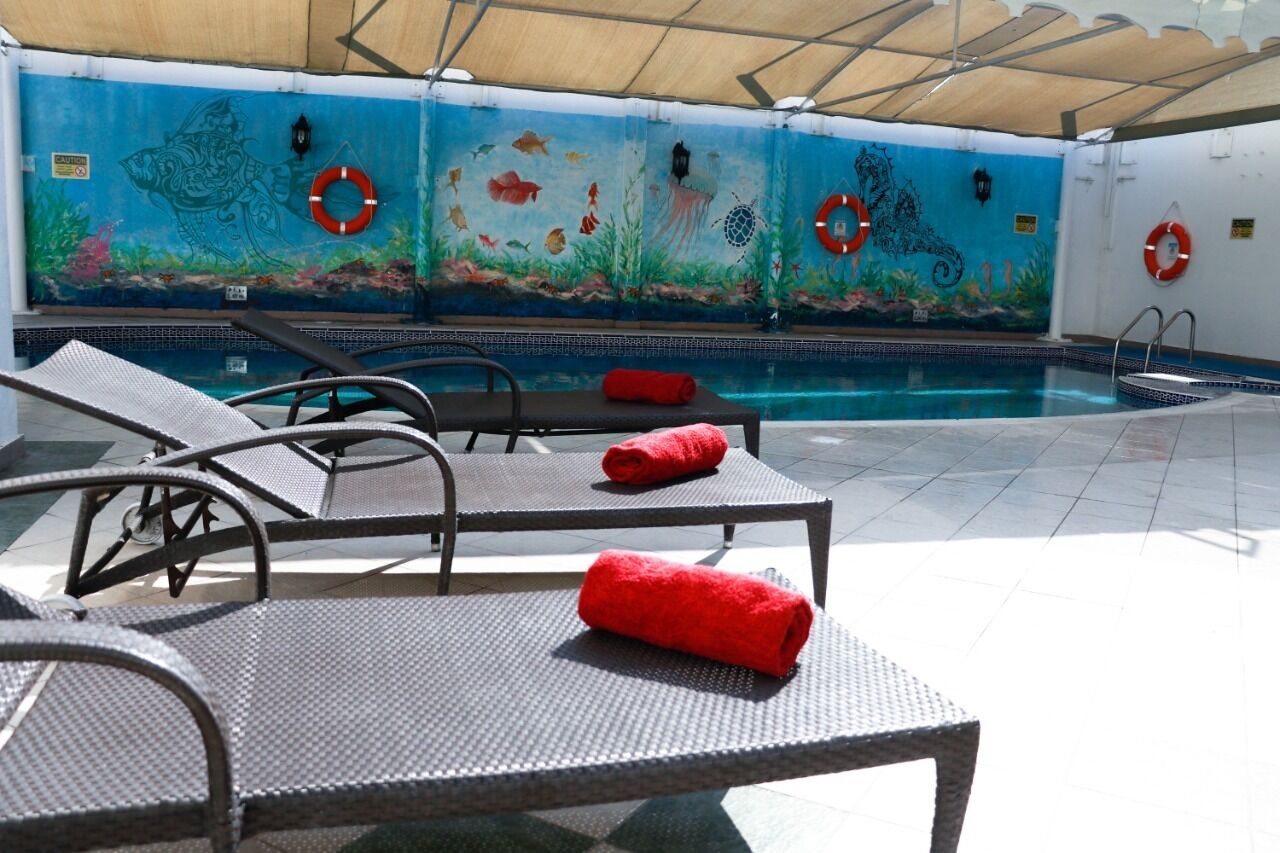 Indoor pool, free pool cabanas, pool umbrellas