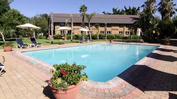 Outdoor pool, pool umbrellas, pool loungers