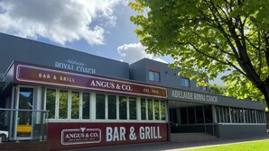 A building with a sign for 'Adelaide Royal Coach Bar & Grill' and 'Angus & Co. Bar & Grill'. - Adelaide Royal Coach (Kent Town)