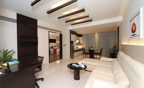 Premium Room, 1 Bedroom | Living area | 32-inch TV with satellite channels