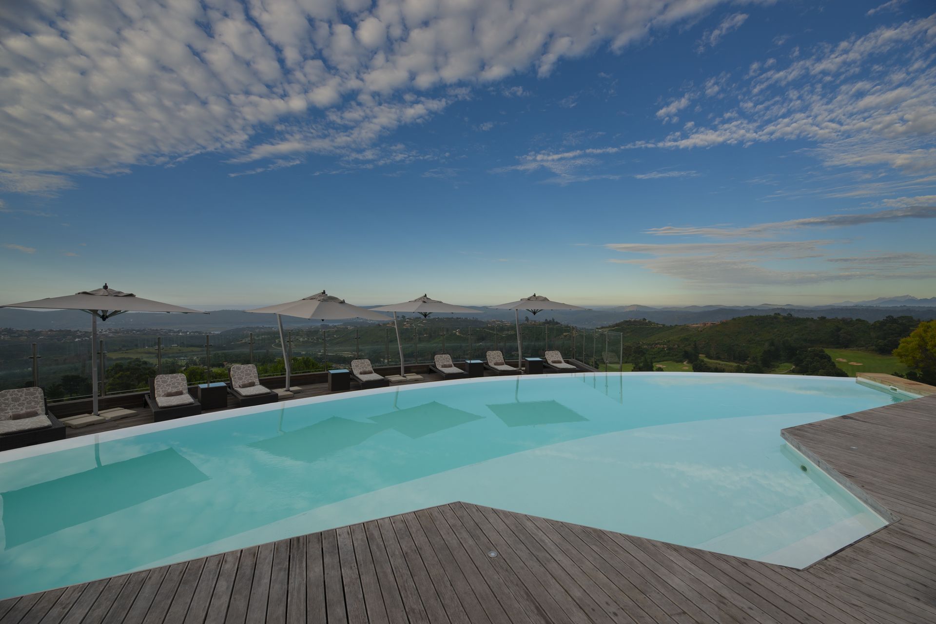 indoor pool, outdoor pool, pool umbrellas, pool loungers