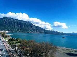 A coastal road with a mountain in the background. - Pharae Palace Hotel (Kalamata)