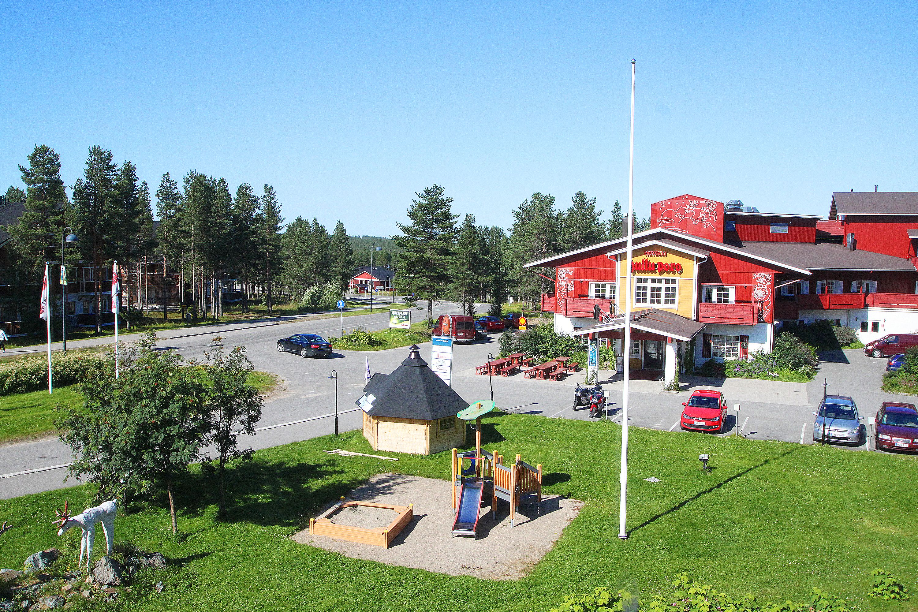 A red building with a sign reading "Motel".