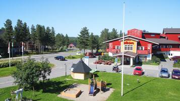 A red building with a sign reading "Motel".