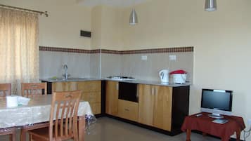 Apartment, 2 Bedrooms | Private kitchen | Fridge, microwave, coffee/tea maker, electric kettle