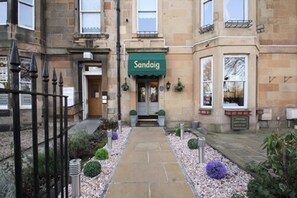 A building with a green awning labeled "Sandaig" at the entrance. - Sandaig Guest House (Edinburgh)