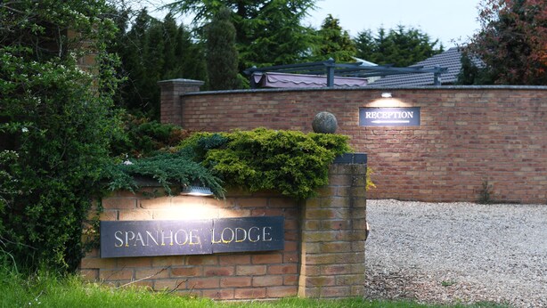 A brick wall with a sign reading "SPANHOE LODGE" and a "RECEPTION" sign above it. - Spanhoe Lodge - B&B (Corby)