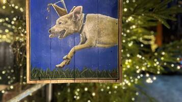A sign for 'The Doghouse' with a dog illustration.