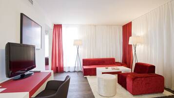 Senior Suite, 1 Queen Bed | Living room | 32-inch LCD TV with cable channels, TV, video-game console