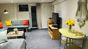 Superior Apartment | Living area | Flat-screen TV