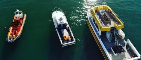 Three boats on a body of water.