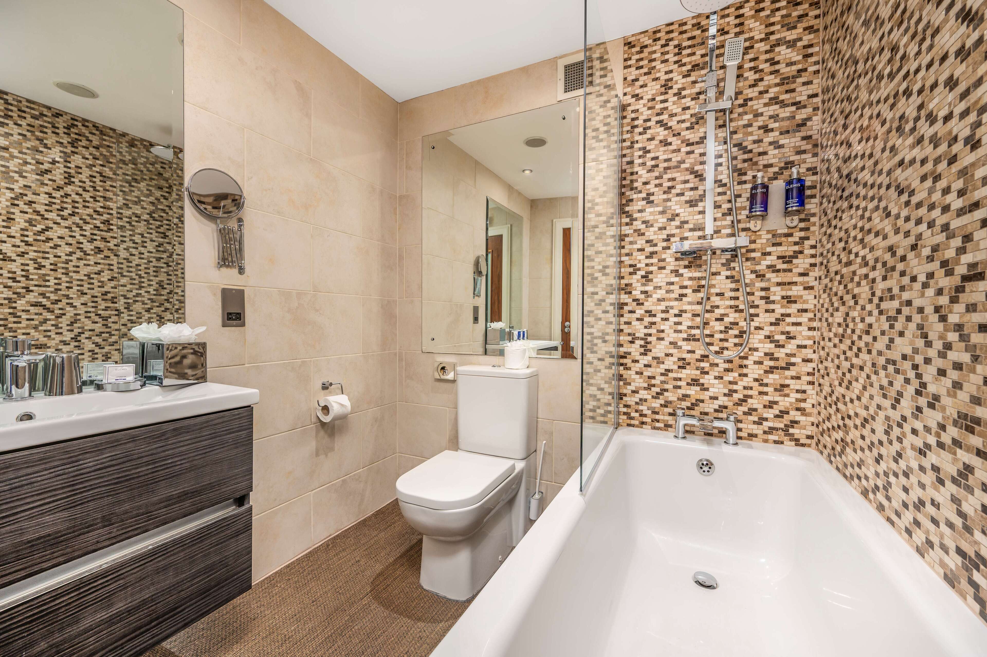 hip | bathroom | separate bathtub and shower, deep-soaking bathtub, rainfall showerhead