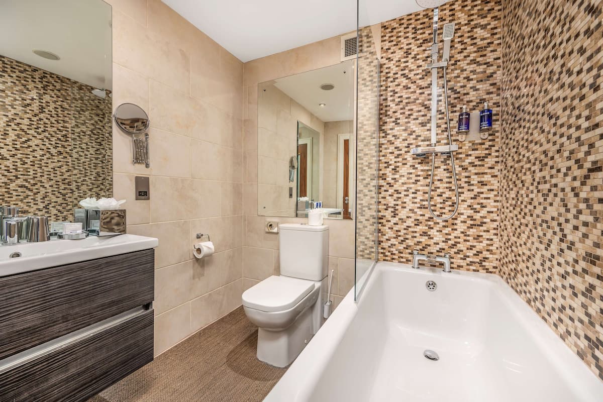hip | bathroom | separate bathtub and shower, deep-soaking bathtub, rainfall showerhead