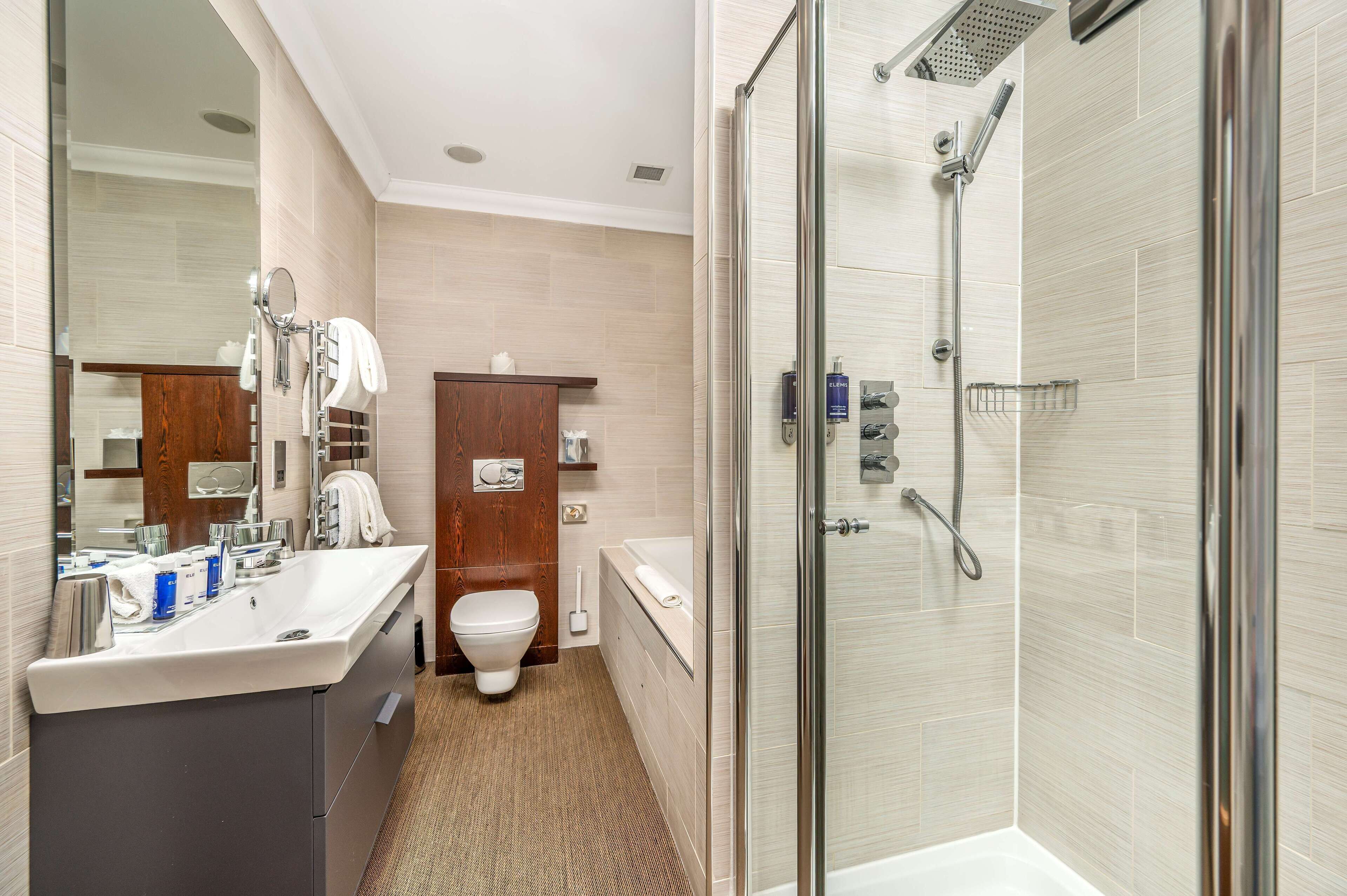 chic | bathroom | separate bathtub and shower, deep-soaking bathtub, rainfall showerhead