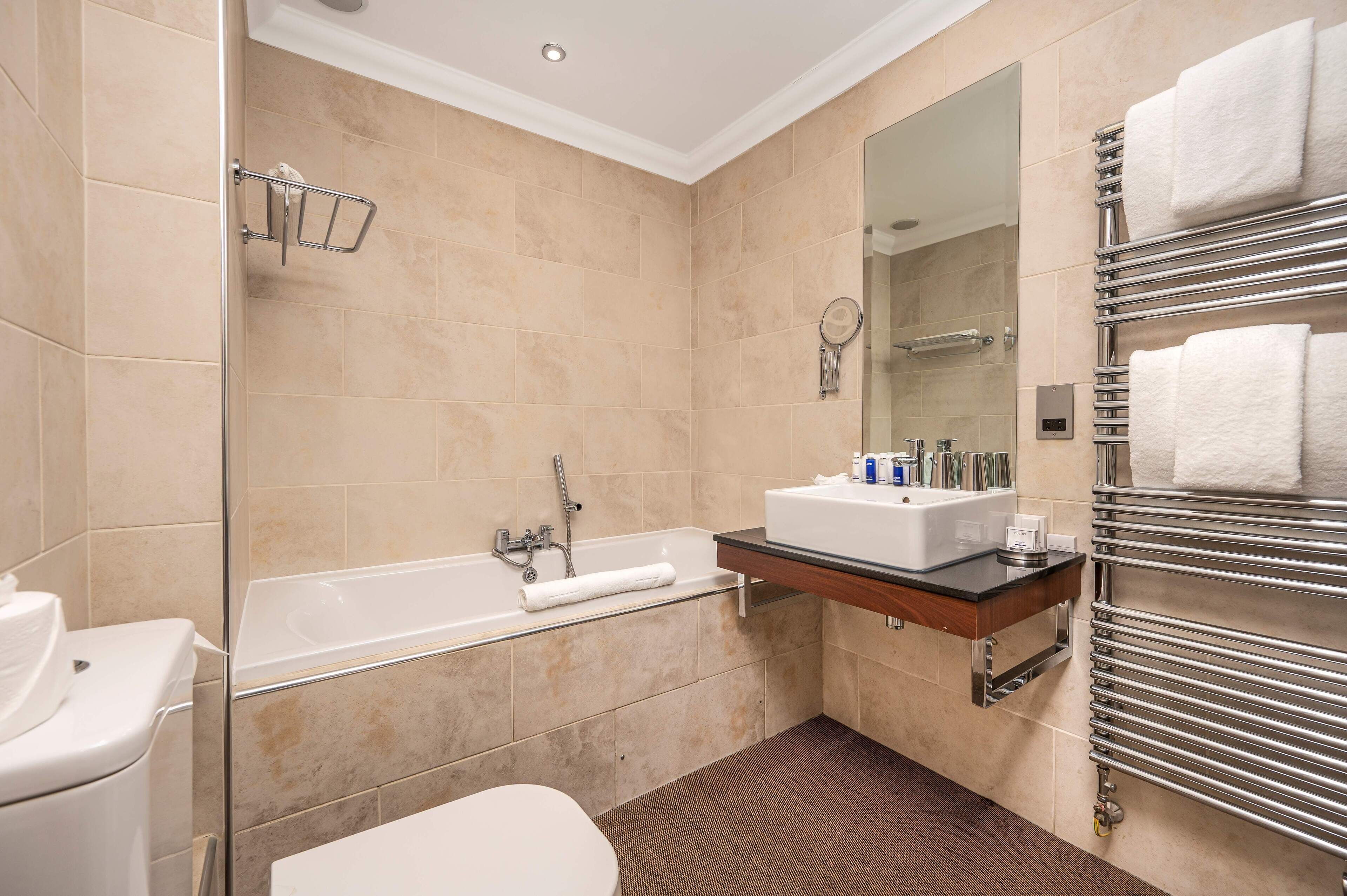 hip | bathroom | separate bathtub and shower, deep-soaking bathtub, rainfall showerhead