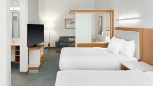 A hotel room with two beds, a TV, a desk, a chair, and a mirror. - SpringHill Suites Detroit Auburn Hills (Lake Orion)