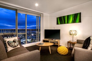 Tower Suite | Living area | 40-inch flat-screen TV with cable channels, TV