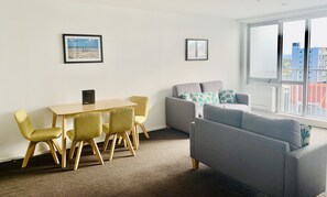 Executive Two Bedroom Suite | Living area | 40-inch flat-screen TV with cable channels, TV