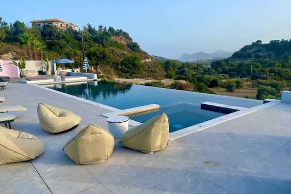 Seasonal outdoor pool, open 10:00 AM to 8:00 PM, pool umbrellas