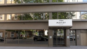 A building with a sign reading "Pakat Living" above the entrance. - Pakat Suites (Vienna)